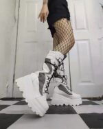 White platform y2k punk boots with laces and chunky sole.