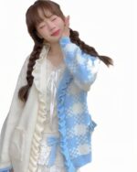 Milkshake aesthetic cardigan featuring a blue and white floral knit, with ruffles and a tie detail.