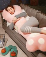 Cute Super Soft Cat Paw Sleeping Pillow resting on a couch for comfortable sleep.