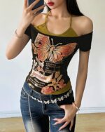 Butterfly y2k t-shirt featuring a graphic print on a dark fabric, off-shoulder style.