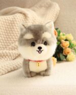 Grey puppy collectible plush with a red collar and tag, soft plush material.