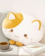 Cute kawaii cat plushie, a soft, white stuffed animal with orange ears and cheeks.
