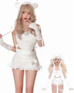 Woman wearing a kawaii coquette set: cream-colored crop top and skirt with lace trim, matching gloves and hooded cardigan.