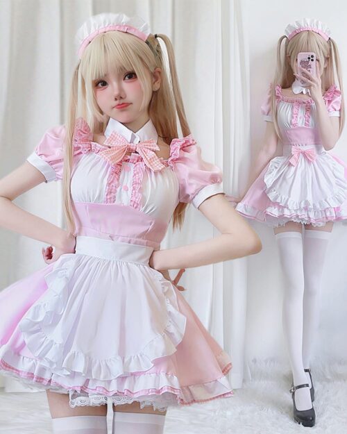 Pink maid costume featuring a kawaii aesthetic with frills, lace, and a bow. A white and pink outfit.