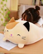 Kawaii animal mochi plushie, a large, soft, tan cat plush with black ears and facial markings.