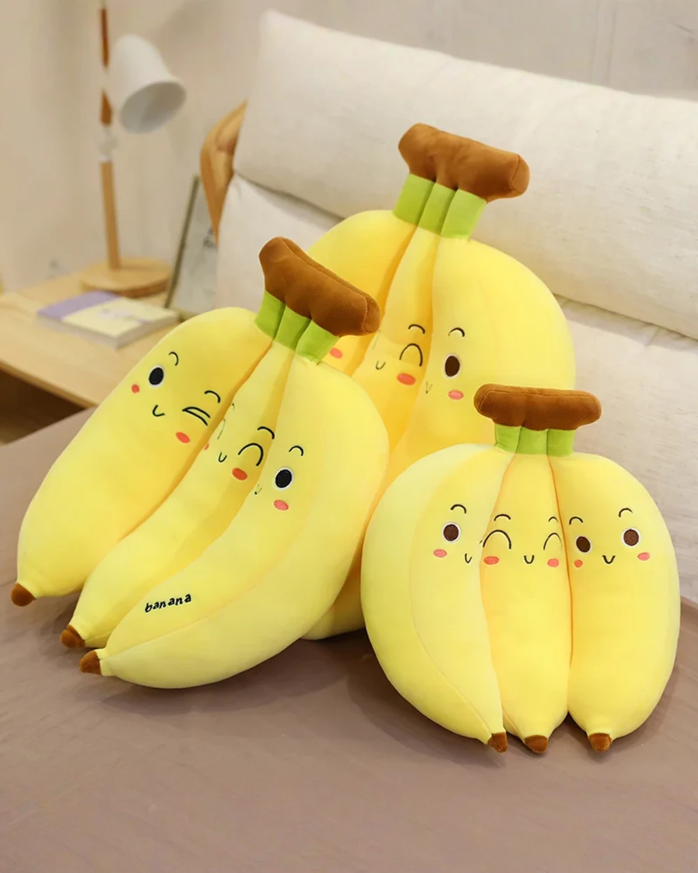 Cute yellow banana plushies, three pack edition. Soft and adorable toy bananas.