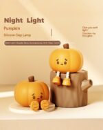 Two Pumpkin Night Silicone Lamps, Kawaii Halloween decoration, with a brown stand and soft light.