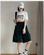 Black Korean aesthetic shorts with a drawstring waist, paired with a shirt and suspenders.