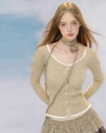 Light beige vintage aesthetic cardigan worn by a model.