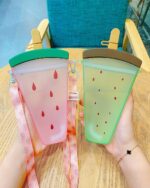 Two kawaii fruit bottle designs – pink watermelon and green melon – with straps and clips.