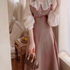 Pink puff sleeve french aesthetic dress with frilled collar and sleeves, close-up view.