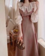 Pink puff sleeve french aesthetic dress with frilled collar and sleeves, close-up view.