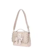 Light pink vegan leather jirai kei bag with ruffles and a bow.