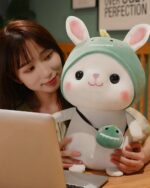 Cute kawaii bunny plushie, Cotton the Adventurous Rabbit, featuring a hat and smaller plush turtle.