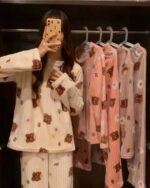 Coral-printed bear **korean aesthetic pajamas** suit on display, featuring a plush fabric design.