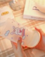 Kawaii pen holder featuring a cute bunny character with a rainbow, pink design.