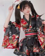 A woman wearing a kawaii short yukata with a floral pattern and accessories.