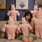 Muscle Pink Rabbit Plushie - Buff Edition, a large pink plush bunny with prominent muscle details.