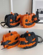 Cute pumpkin halloween bag, orange and black crossbody bag with a zipper closure.