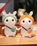 Two kawaii bunny plushies with hats and carrots, aesthetic rabbit toy.