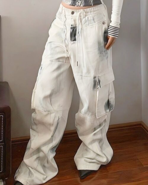 Washed out y2k artsy pants, baggy cargo style jeans with distressed details.