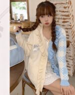 Cream and blue harajuku aesthetic cardigan with ruffles and a bear graphic.