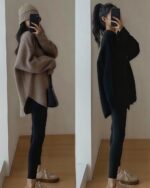 Two women wearing a Korean style sweater, one beige and one black, with leggings and boots.