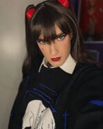 Model wearing an anime aesthetic sweater featuring a skull and crossbones design.