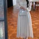 Long Sleeve Fairy Dress in a light beige color, featuring delicate lace details and a flowing silhouette.