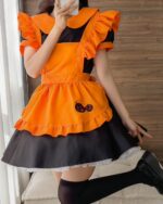 Cute Halloween dress with orange apron and black skirt, kawaii aesthetic fashion.