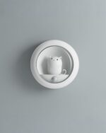Kawaii cat lamp, a body-activated night light shaped like a cute cat, mounted on a wall.