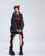 Red and black punk lolita skirt with ruffles and lace details layered under a hoodie.