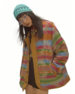 Colorful vintage aesthetic jacket worn by model, featuring a plaid design.