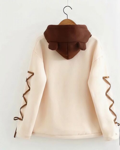 Kawaii Harajuku kuma bear hoodie with brown bear ears on a light pink sweatshirt.