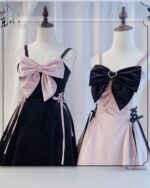Two Dark Bowed Dress - Kawaii Goth dresses on mannequins, featuring pink and black color schemes.