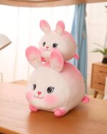 Kawaii Berry the Strawberry Bunny Plushie, a soft pink plush rabbit toy.