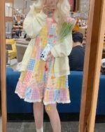 A cute colorful jojifuku aesthetic dress with a patchwork design, featuring a layered skirt and white socks.