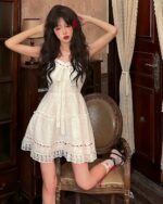 Lolita white laced dress, a delicate, layered dress with lace details and a bow accent.