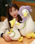 Kawaii Molly the Little Flower duck plushie toy resting on a table with a woman.