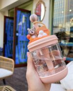 A kawaii bear bottle - U Cup, clear plastic, with a bear charm.