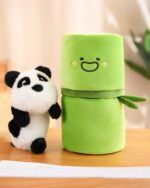 Green panda bamboo plushie and a white panda plush toy next to it.