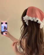 Retro triangle headscarf in gingham, a vintage hair accessory, with frills.