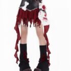 Detailed punk plaid denim skirt with layered ruffles and a belt.