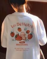 White strawberry bunny t-shirt with fruit and bunny design on the back.