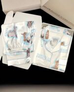 Multiple kitty silky pajamas displayed in a box, featuring a blue and white cat print.