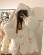 Close-up of a white fluffy rabbit ears hoodie, Kawaii Clothes.