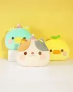 Kawaii plushie handwarmer assortment: teal pig, cat, and yellow duck plushies on a yellow background.