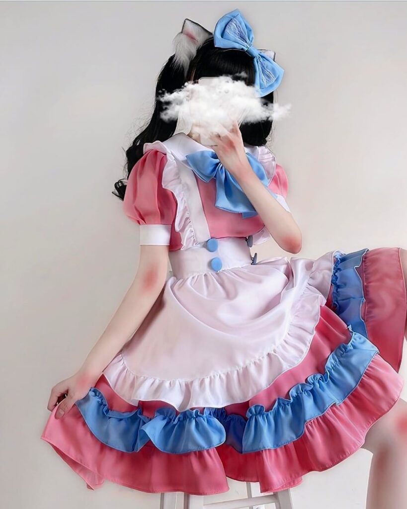 A pink and blue kawaii maid dress with ruffles, featuring cat ears and a bow.