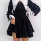 Black gothic nun dress featuring a high collar and lace details, with a fitted bodice and flared skirt.