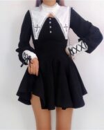 Black gothic nun dress featuring a high collar and lace details, with a fitted bodice and flared skirt.